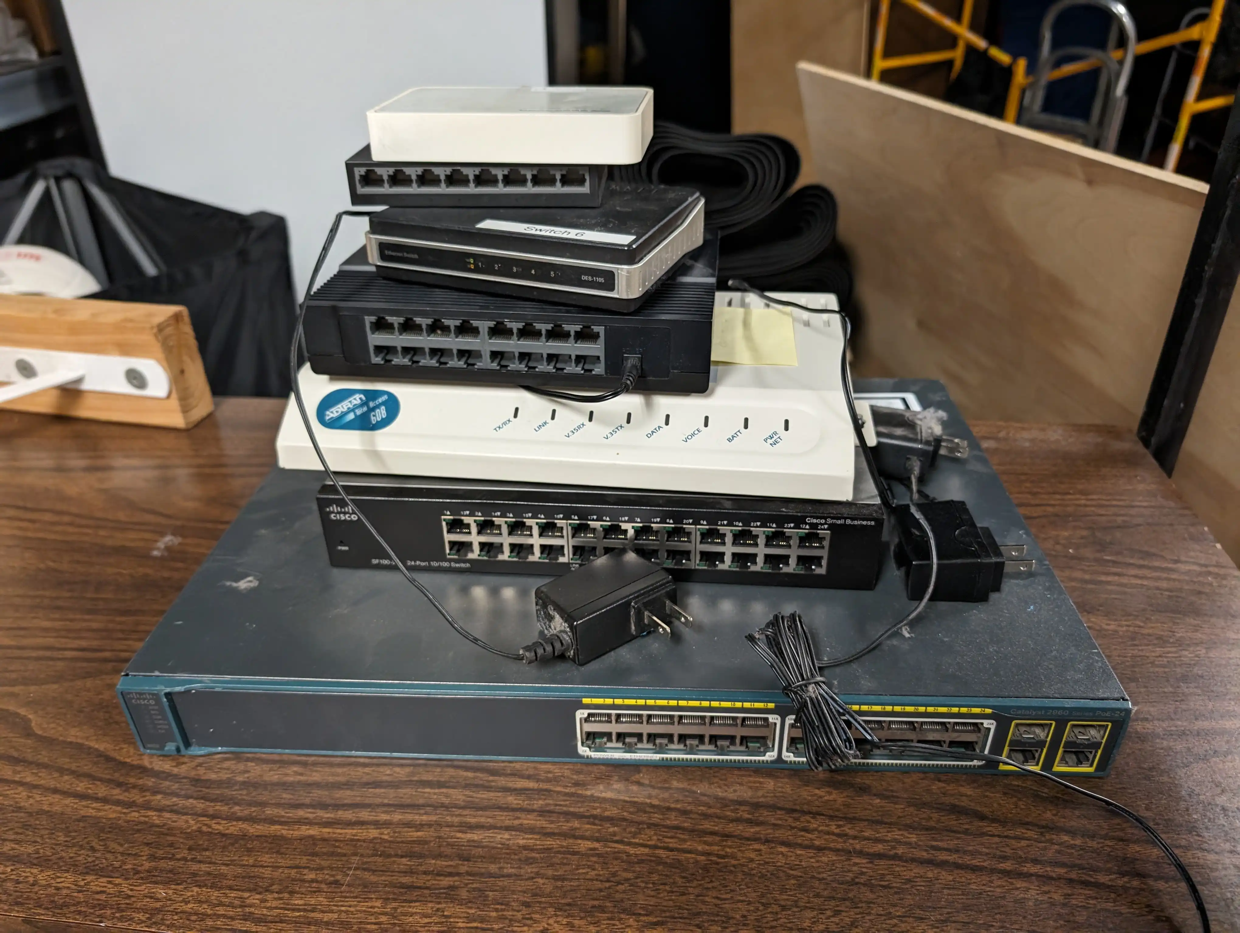 Aging mixed-brand network switches being replaced at Springfield Family YMCA showing typical nonprofit equipment challenges with mismatched hardware accumulated over years